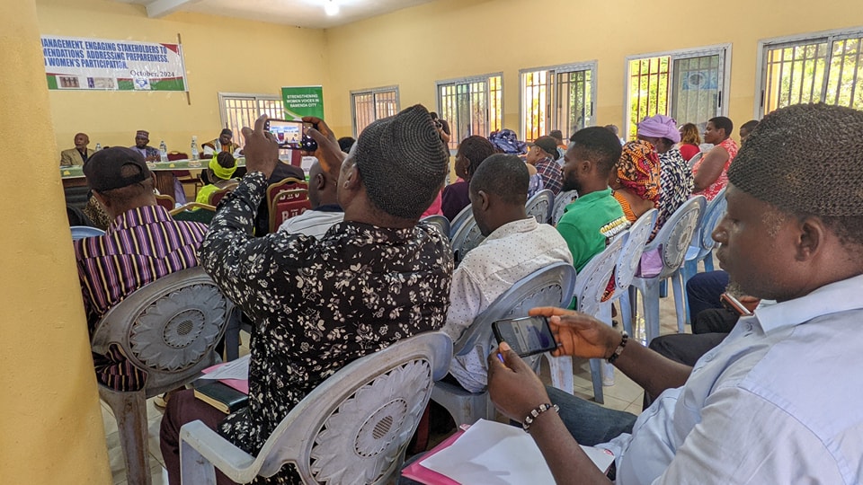 Fenwi Linda presenting project findings to government officials